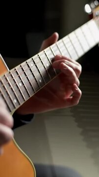 Dynamic ECU to MCU video on diverse hands of various skin tones precisely practicing on polished piano keys then acoustic guitar strings, with shallow depth of field, stunning bokeh, and diffused