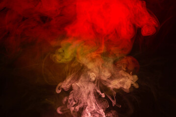 Yellow and pink steam on a black background.