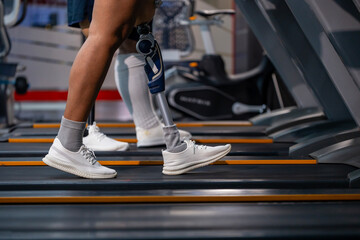 People with disability doing walking workout exercise using treadmill at gym for healthy and recovery