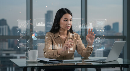 Woman interacting with holographic data in a modern office,Data analyst interacting with a futuristic display in a high-rise office