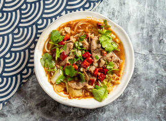 Spicy Sichuan Boiled Beef with Chilies and Vegetables in a Flavorful Broth top view of Chinese food