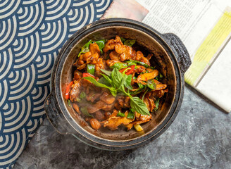 Traditional Frog with Basil in a Clay Pot top view of Chinese food