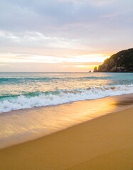Obraz premium Photorealistic, wide-angle shot of a gentle ocean wave. A low perspective captures the serene blue water and foamy white crests under a clear sky