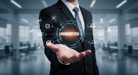 Businessman in suit presenting a digital hologram with the word "Innovation" surrounded by various technology and business icons in a modern office setting.