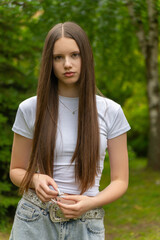 A beautiful young girl with long dark blonde hair
