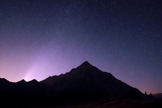 striking mountain silhouette starry zodiacal aesthetic design  
