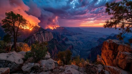 Wildfire and lightning storm over canyon cliffs during vibrant sunset view.
