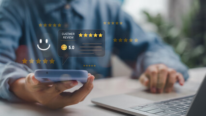 User holding smartphone showing digital customer review with 5-star rating and satisfaction...