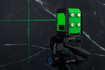 Laser spirit level during finishing works in flat