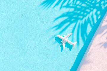 Airplane model on blue background for aviation and wanderlust inspiration
