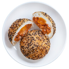 Deep-fried Chinese bun filled with BBQ pork and salted egg yolk, topped with white and red sesame...