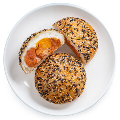 Deep-fried Chinese bun filled with BBQ pork and salted egg yolk, topped with white and red sesame seeds Asian street food snack isolated on white background PNG File.