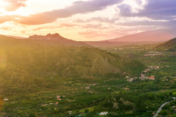 amazing highland view from above to a canyon and valley between mountains and green hills, cloudy...