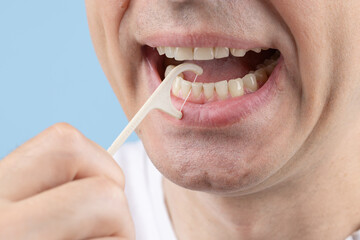 A man Cleaning Teeth With Dental Floss, Dental care, Tooth decay concept