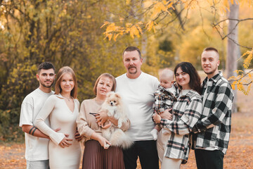 Big happy family in autumn park. Autumn. Autumn mood.