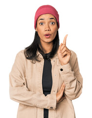 Young Filipino woman in studio having some great idea, concept of creativity.