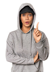Young Filipino woman in studio having some great idea, concept of creativity.