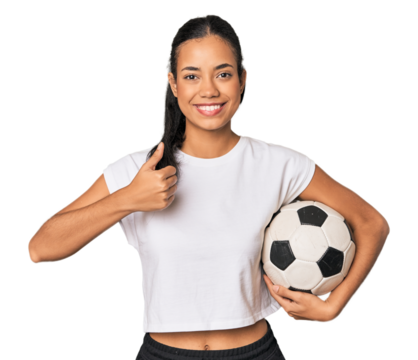 Young Filipino woman with soccer ball smiling and raising thumb up - Powered by Adobe