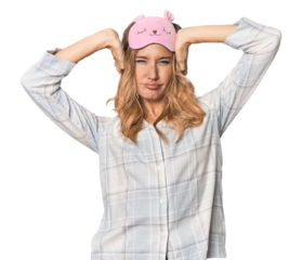 Blonde pretending to sleep in cozy pajamas