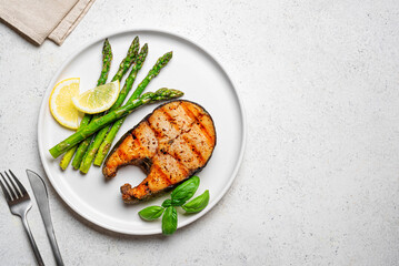 Grilled salmon steak with roasted green asparagus