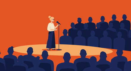 Woman speaking at a microphone on a stage in front of an audience