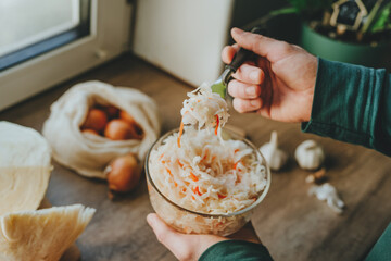 Preparing Sauerkraut with Fresh Cabbage in Kitchen
