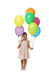 Happy little girl in dress with many colorful balloons on white background