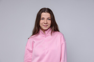 Fototapeta premium Portrait of teenage girl on light grey background