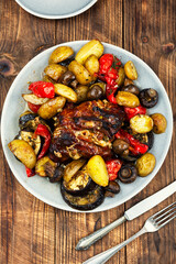 Baked meat dish with vegetables.