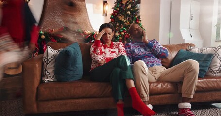 Frustrated parents, christmas or headache on sofa with chaos for burnout, ADHD kids or busy home. Tired, mom and dad with running children, anxiety or fatigue for stress in crazy living room or house - Powered by Adobe