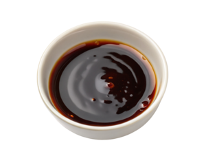 Dark soy sauce in a white bowl isolated on black background asian cuisine ingredient liquid