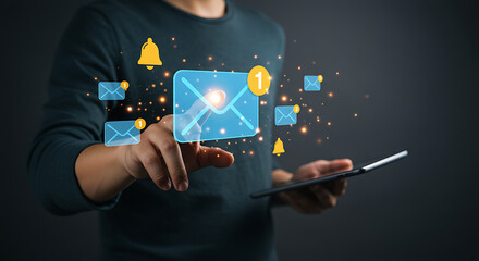 A person interacts with a digital email interface projected onto a tablet.