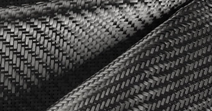 Carbon fabric in close-up on a rotating table. Raw materials for carbon production.