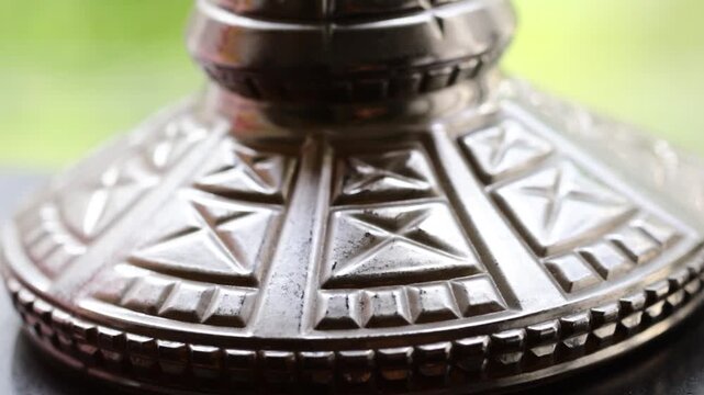 Hoad hook is close -up against the background of nature. Tobacco smoking device
