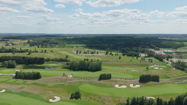Aerial view of TPC Toronto Golfcourse on a sunny day with lush scenery