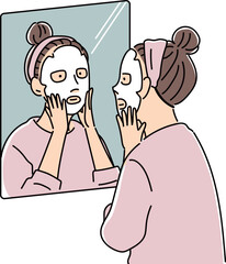 鏡の前でパックをする女性