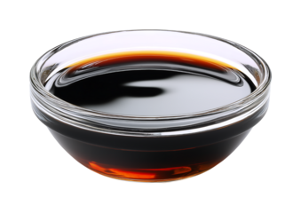 A bowl of dark brown soy sauce isolated on a transparent background