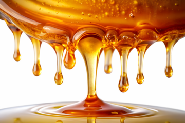 Golden honey dripping in slow motion, isolated on transparent background, showcasing its viscous and sweet texture, perfect for food and culinary themes