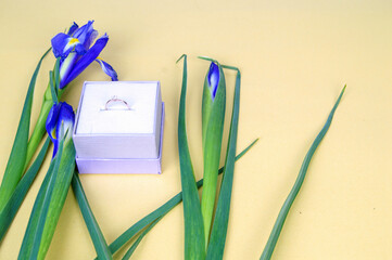 purple iris flowers and engagement ring