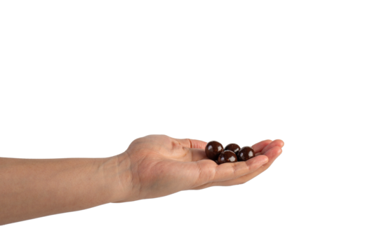 Chocolate ball in hand on transparent background