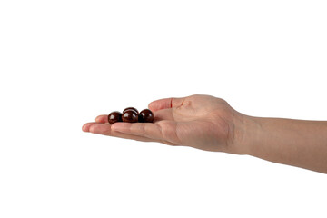 Chocolate ball in hand on transparent background