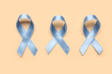 Blue awareness ribbons on color background. Prostate cancer concept