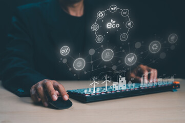 A person interacts with a computer, surrounded by eco-friendly icons and data visualizations, highlighting sustainability and technology.