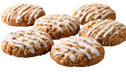 Several round oatmeal cookies with a white icing drizzle