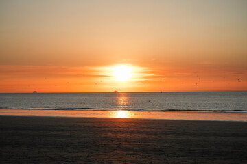Bright sunset at the sea on the coast near Calais.
