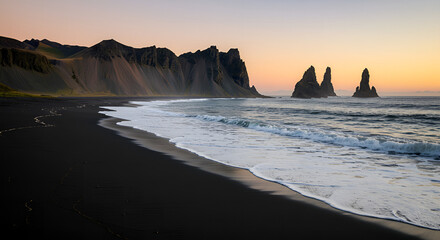 Stunning view of black sand beach and the Reynisdrangar sea stacks in Iceland at sunset, perfect for travel, nature, and majestic landscape themes.