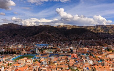 Panoramic view of Cusco, Peru cityscape and mountains.