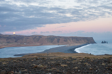 Majestic mountains reflect in the crystal clear water of a stunning lake in the beautiful landscape of Iceland