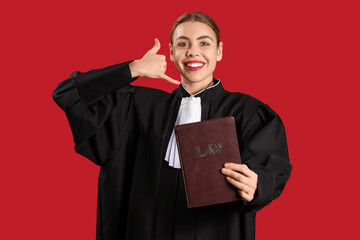 Young judge with law book showing 