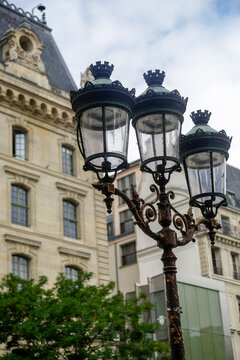 Paris, France, Europe. Antique street lamp and typical Parisian architecture